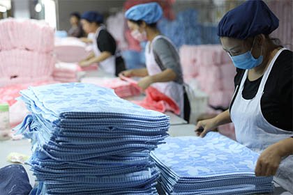 Workers packaging towels